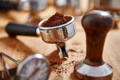 Espresso grounds and coffee tamper