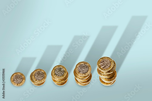 Ascending stacks of pound coins with bar graph growth shadow
