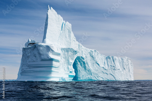 Majestic iceberg formation on sunny blue Atlantic Ocean Greenland photo