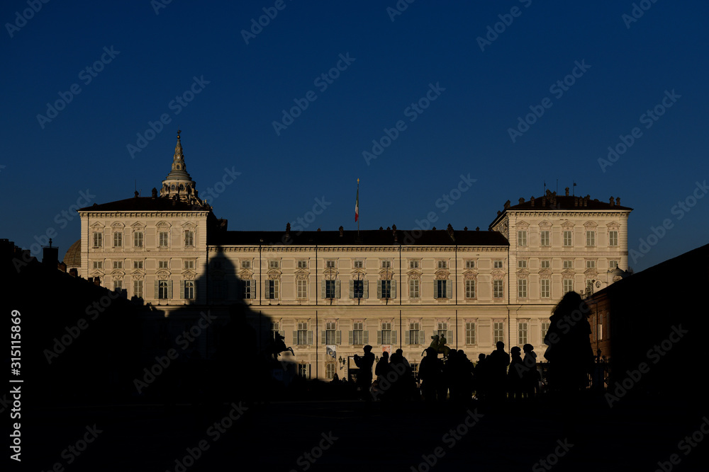 Piazza Castello in Turin, Italy with silhouette of people