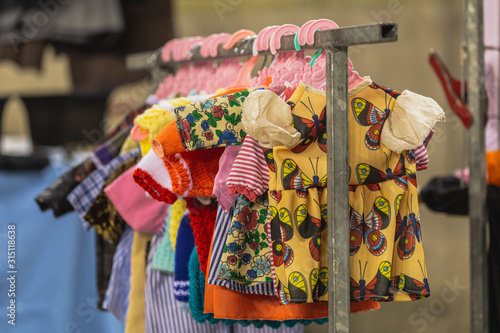 Vintage clothes hanging on clothes hanger on a rail © HildaWeges