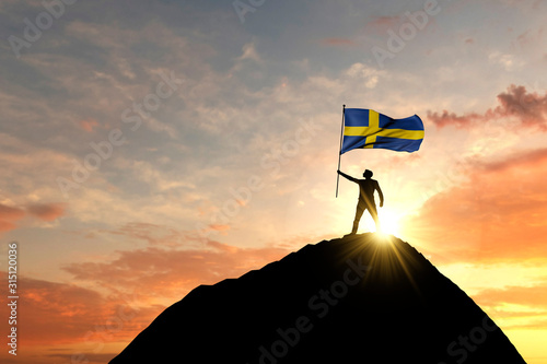 Sweden flag being waved at the top of a mountain summit. 3D Rendering
