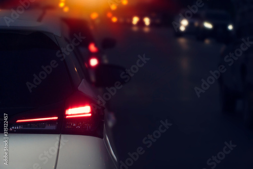 Blurred image of cars on the road with light break at in night. © thongchainak