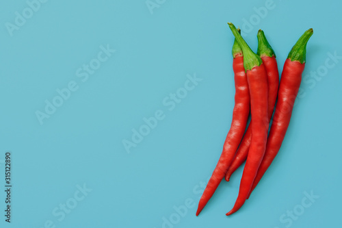 red chili peppers on an azure background