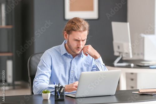 Handsome businessman workin...