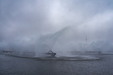 Water steam huge fountains from pipes. Plant cooling outside. Fog in the air in winter