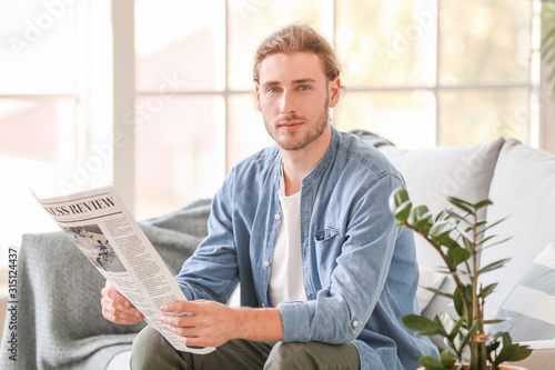 Handsome man with newspaper...