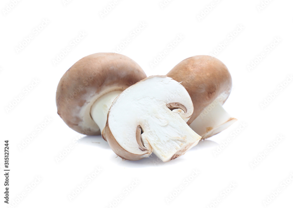 Fototapeta premium Fresh champignon mushrooms isolated on white