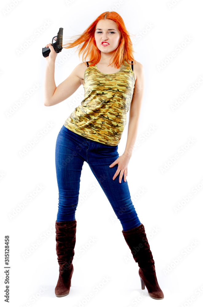 Portrait of beautiful redhead girl with gun on bright background Portrait of beautiful redhead girl with gun on bright background