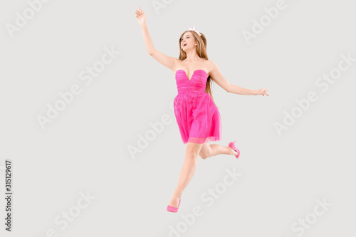 Jumping young woman in beau...