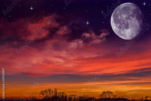 Night background  . Star sky with half-moon in picturesque clouds