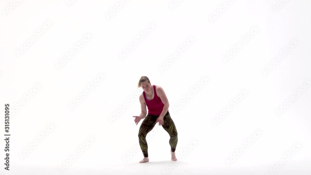 Woman performing incredibly complex of martial art of capoeira. Woman performing incredibly complex of martial art of capoeira.