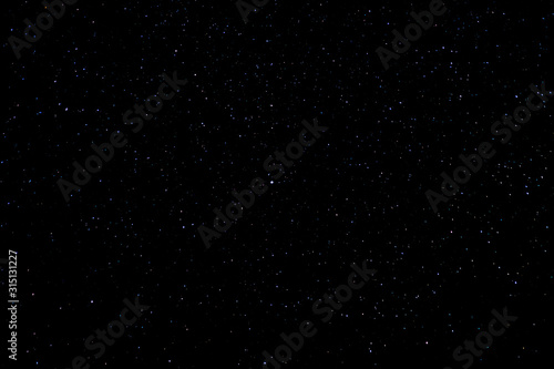 Beautiful shiny starry on the black background. Texture Concept, Polaris star.