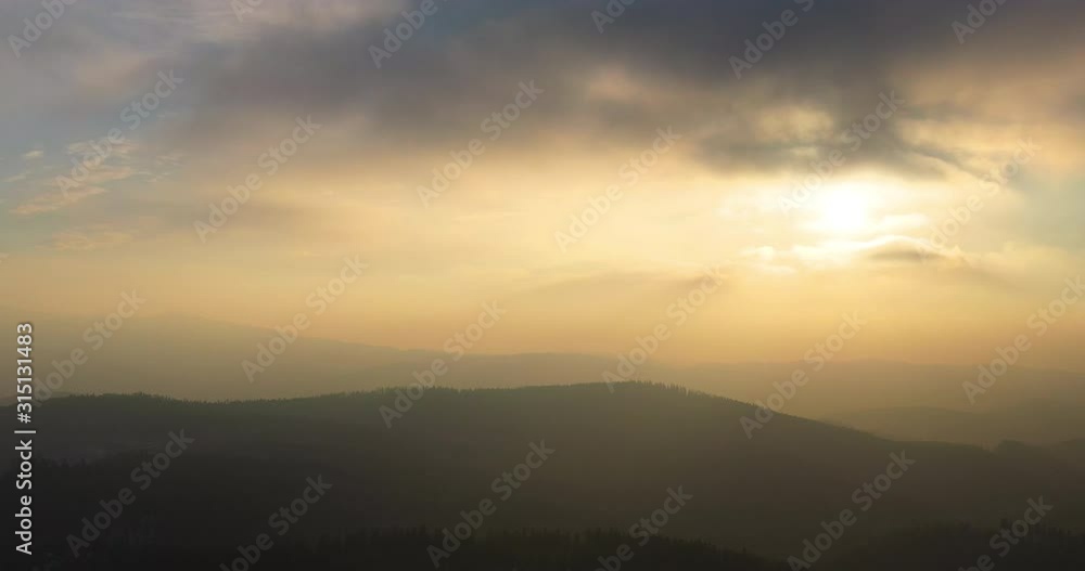 aerial view of woods and mountains in winter aerial view of woods and mountains in winter
