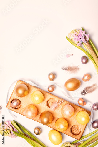 Gold easter decorations on colorful background. Template, banner. Flat design element. Festive background.
