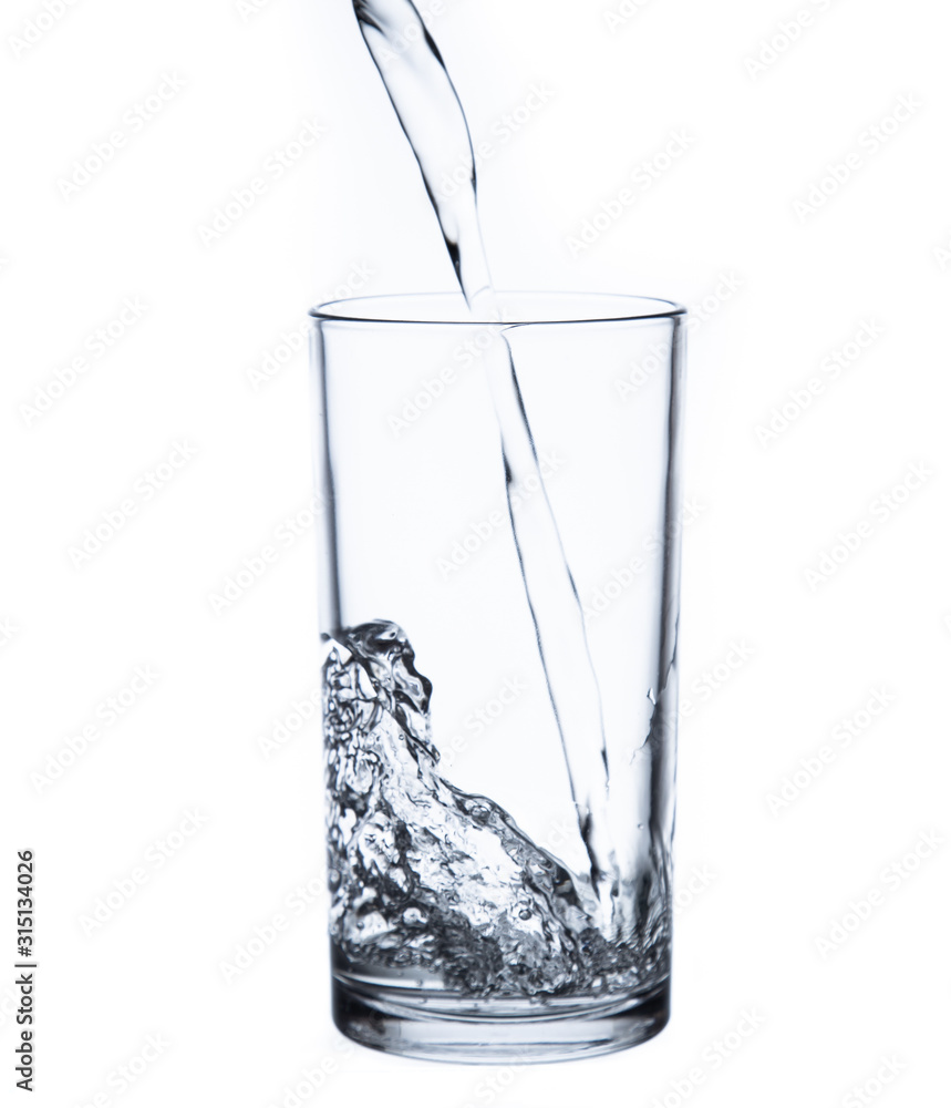 pouring water isolated on a glass on white background pouring water isolated on a glass on white background