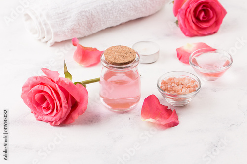 SPA treatment set with sea salt, rose aroma oil and towel roll