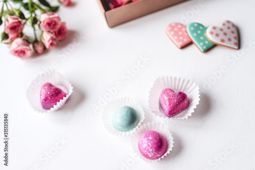 Gift set with hand made sweets in a box on a white table. Flat lay, top view.