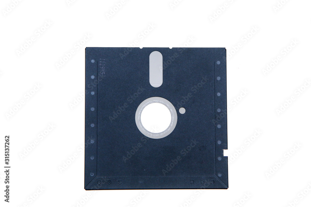 The old retro PC 5 and 1/4 floppy disc isolated on a white background. The old retro PC 5 and 1/4 floppy disc isolated on a white background.