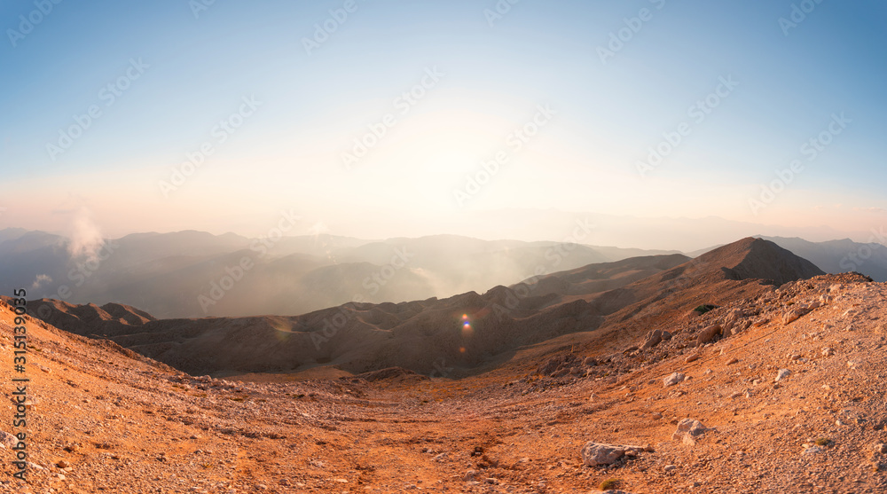 Naklejka premium Panorama of the mountains at sunset.
