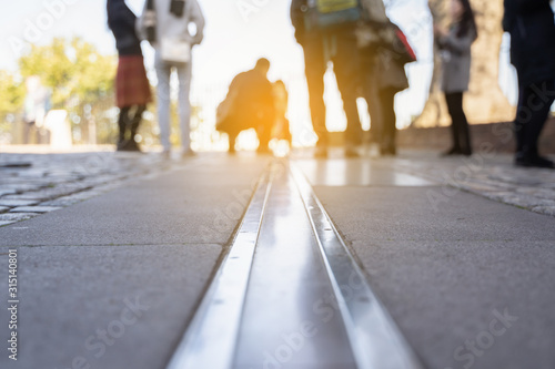 LONDON, UK - October 22, 2018 - Royal Observatory in Greenwich park, London, United Kingdom. The feet and shoes of tourists are on the prime meridian, England United Kingdom