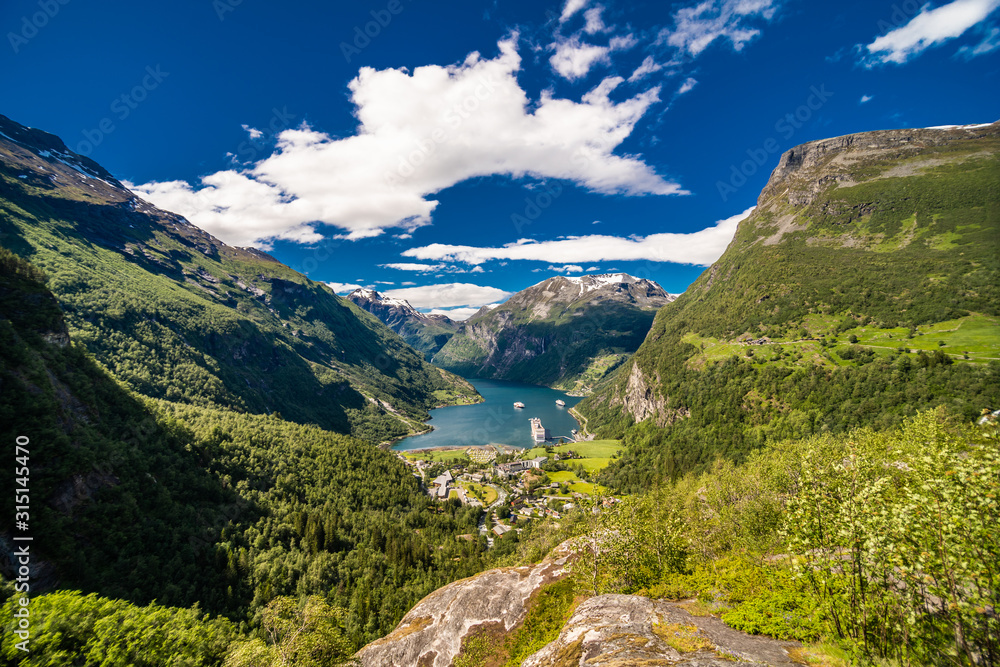 Picturesque summer scene of Geiranger port, western Norway. Colorful view of Sunnylvsfjorden fjord.