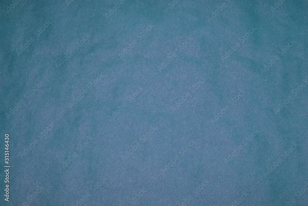 Background from blue paper. Crumpled paper texture. Background, texture of colored parchment paper.