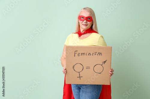 Lady in superhero costume h...