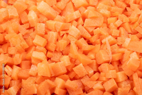 fresh carrots cut into cubes close up