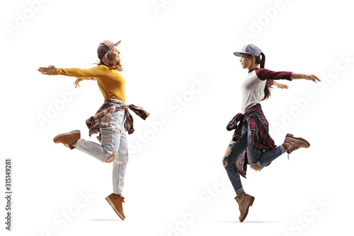 Fototapeta Naklejka Na Ścianę i Meble -  Two women dancing hip-hop style