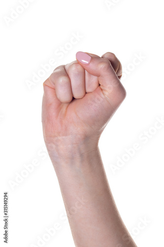 Female hand with fingers folded into fist isolated on white background.