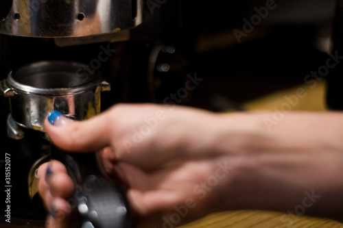 Cappuccino preparation process in coffee shop. Profession barista. The invigorating coffee drink.