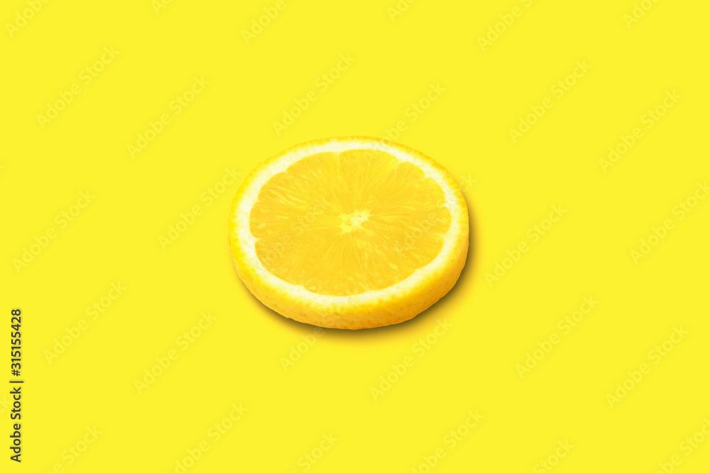 ripe lemon slice on yellow background, citrus fruit on bright ripe lemon slice on yellow background, citrus fruit on bright