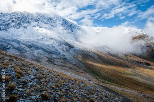 View of the snowed solpes near Atsunta Pass, Georgia photo