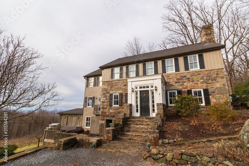 Old House overlooking a vineyard high in the mountains of Virginia on a cold winter day 