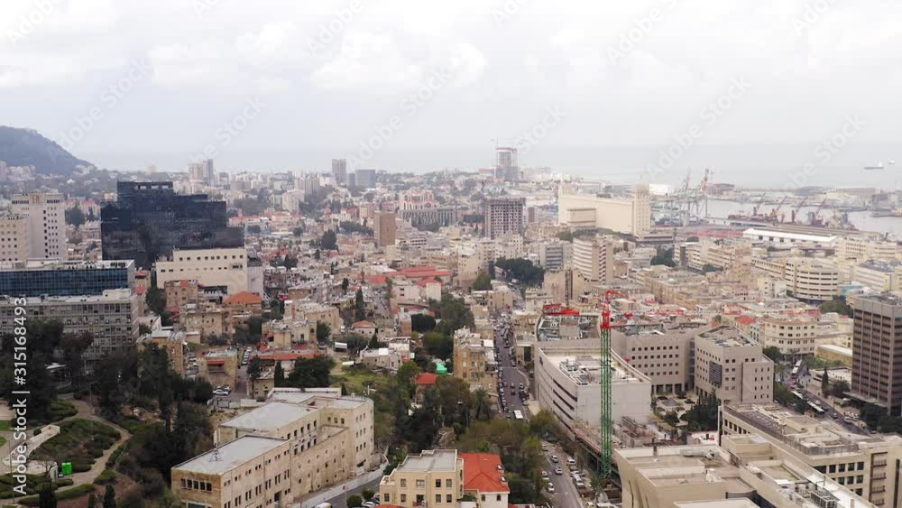 Aerial view of Downtown Haifa, Israel, showing the city skyline with business district and commercial port area.
