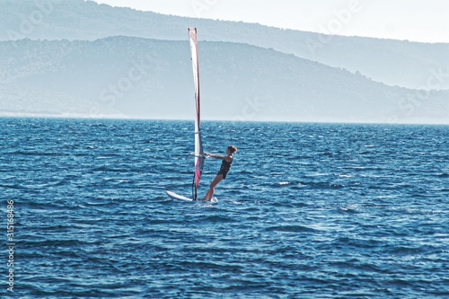Windsurfing on blue sea