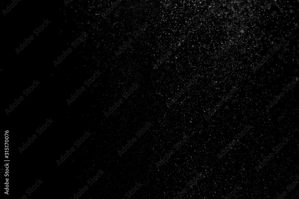 Obraz premium white powder on black background, in defocus. Background abstract.