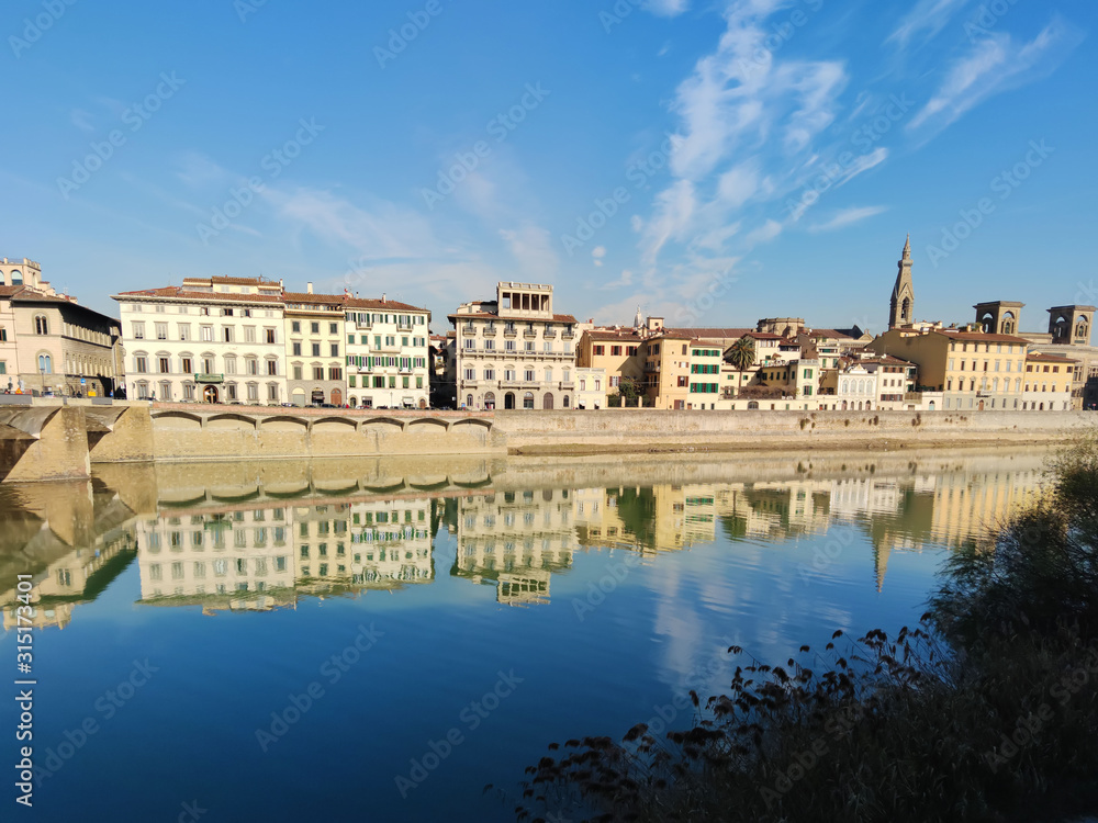 Old buildings on the shore of Arno river