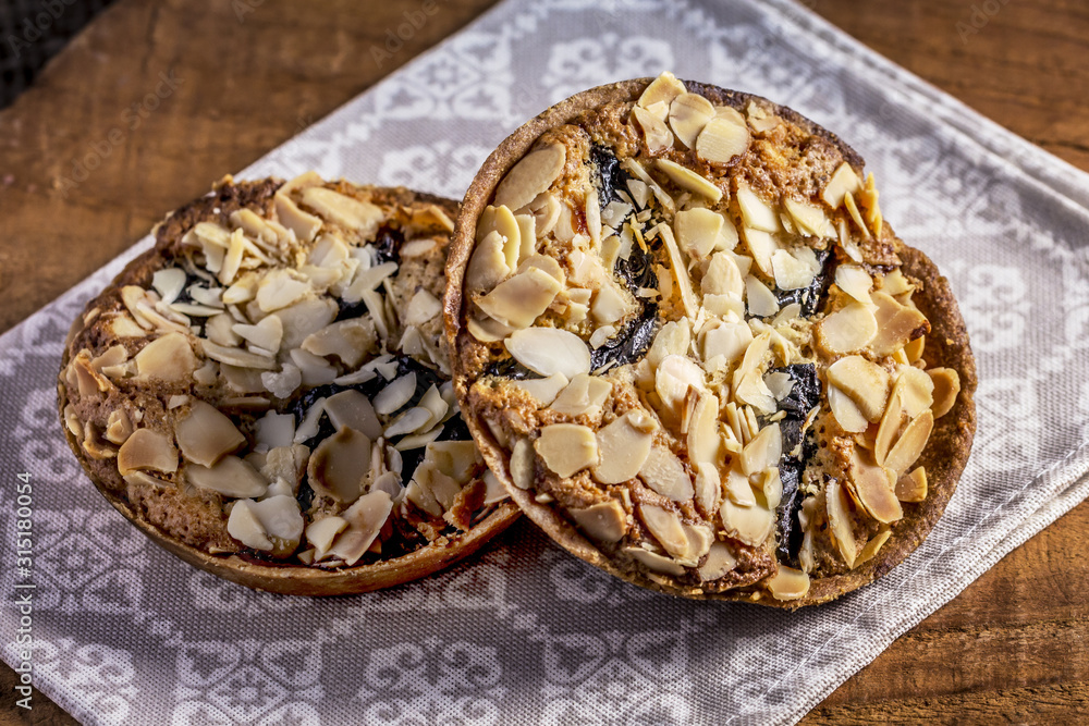 Homemade Almond cookies on wooden table background on napkin, Healthy cookies with prunes and almonds Homemade Almond cookies on wooden table background on napkin, Healthy cookies with prunes and almonds