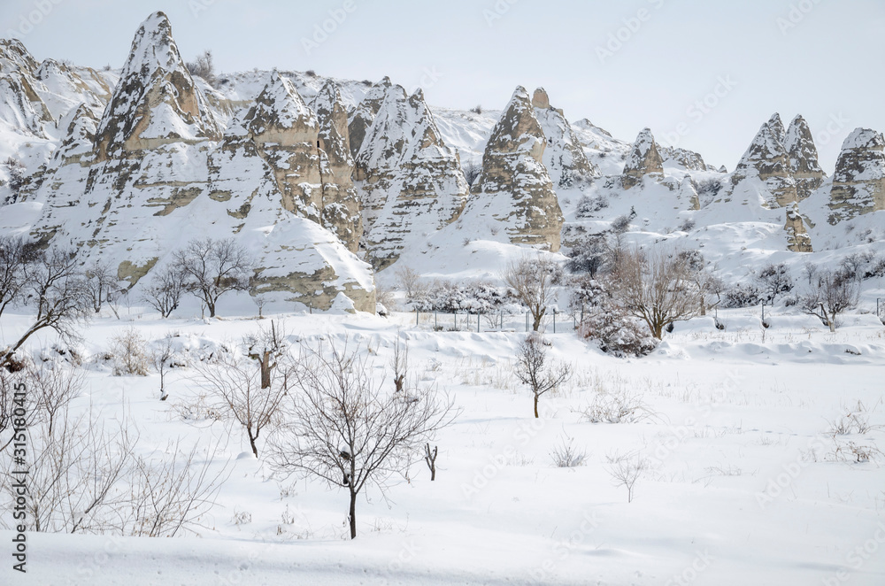 unique geological rock formations under snow in Cappadocia, Turkey. unique geological rock formations under snow in Cappadocia, Turkey.