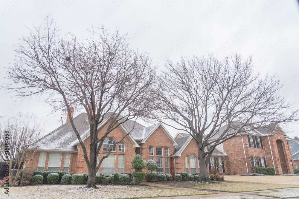 Typical residential house in snow cover near Dallas, Texas, USA