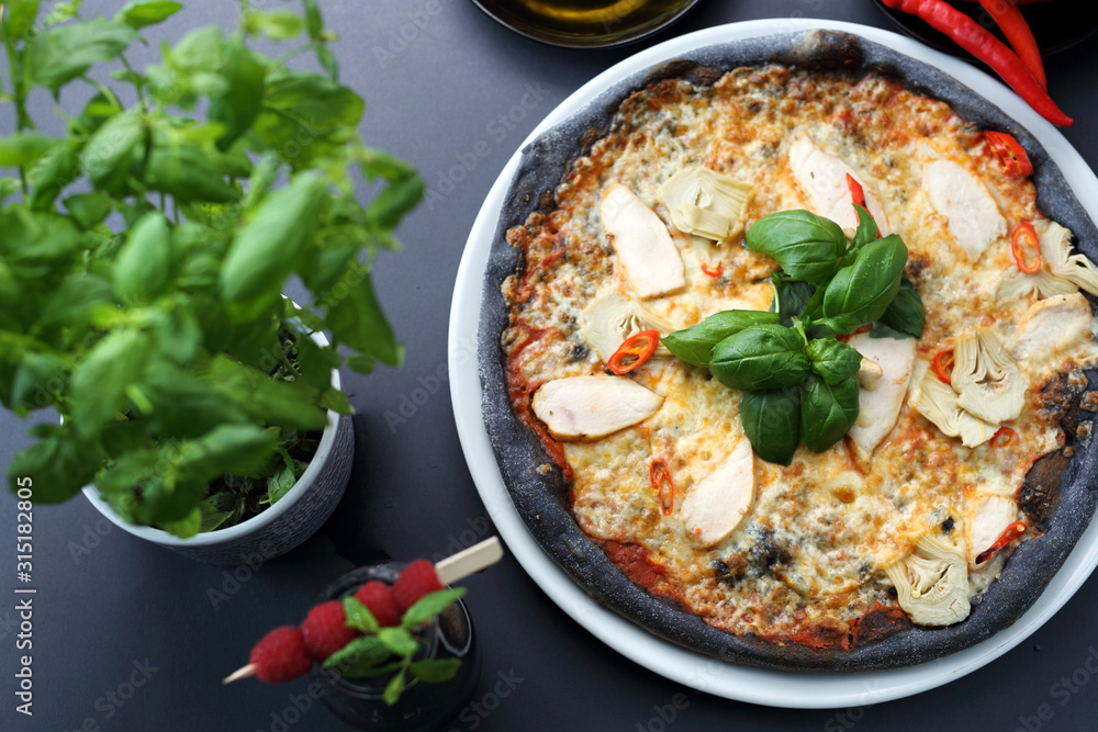 Black pizza, tasty pizza on black dough. Black pizza, tasty pizza on black dough.