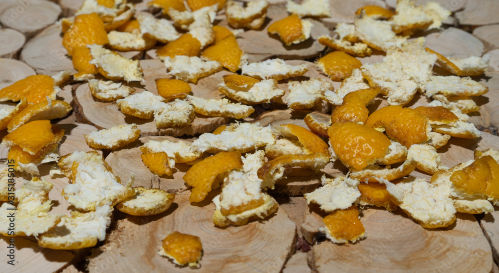 Mandarin peel on a juniper plate Mandarin peel on a juniper plate