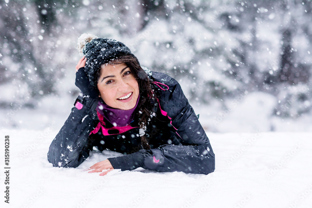 Woman in the High Snowy Mountain in a .Winter Vacation Concept Woman in the High Snowy Mountain in a .Winter Vacation Concept