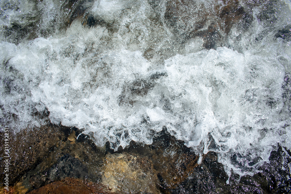 Oceanic waves during storm. Water roll forward and boils at shore, force of nature and beatyful powder blue ,aquamarine Oceanic waves during storm. Water roll forward and boils at shore, force of nature and beatyful powder blue ,aquamarine