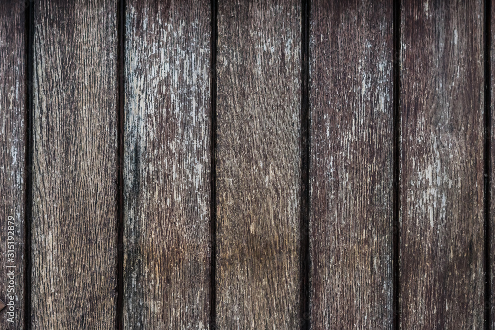 Photo of very old wooden planks, on which there were faint traces of white paint under the influence of time and weather conditions Photo of very old wooden planks, on which there were faint traces of white paint under the influence of time and weather conditions