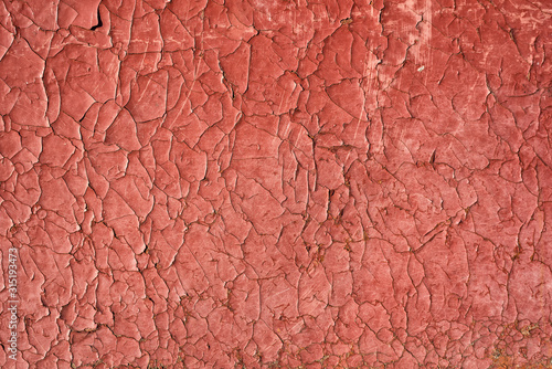 Cracked red paint with rust. Seamless old texture background