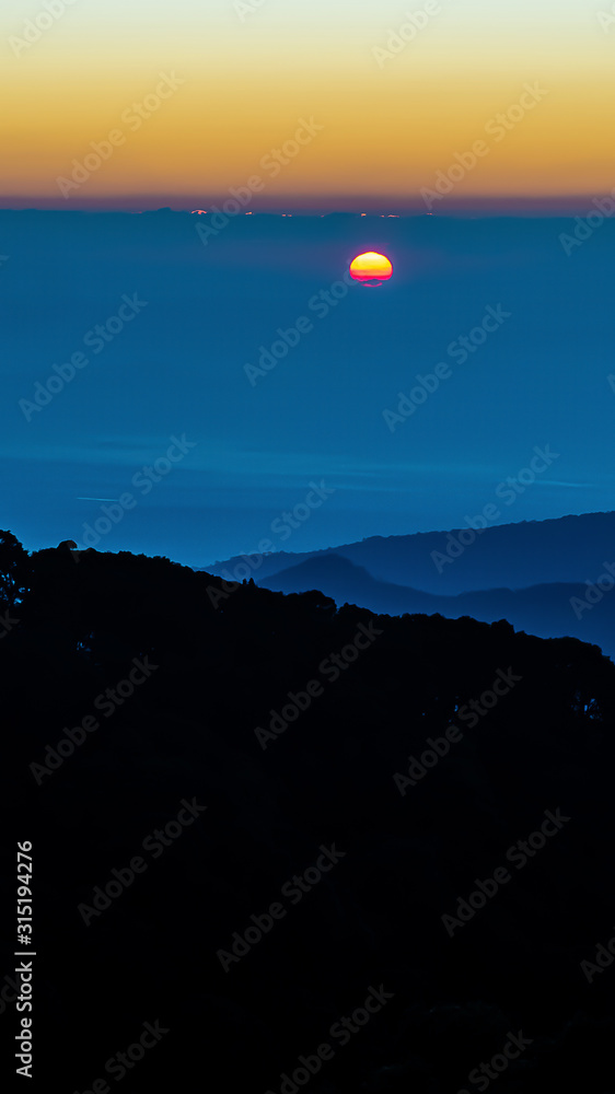 landscape of Mountain with forest and sunset in Twilight time landscape of Mountain with forest and sunset in Twilight time