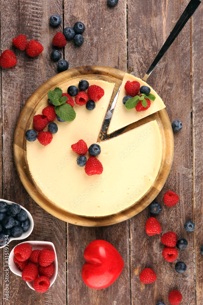 Homemade cheesecake with fresh raspberries and mint for valentines day - healthy organic summer dessert pie cheesecake. Vanilla Cheese Cake for dessert Homemade cheesecake with fresh raspberries and mint for valentines day - healthy organic summer dessert pie cheesecake. Vanilla Cheese Cake for dessert